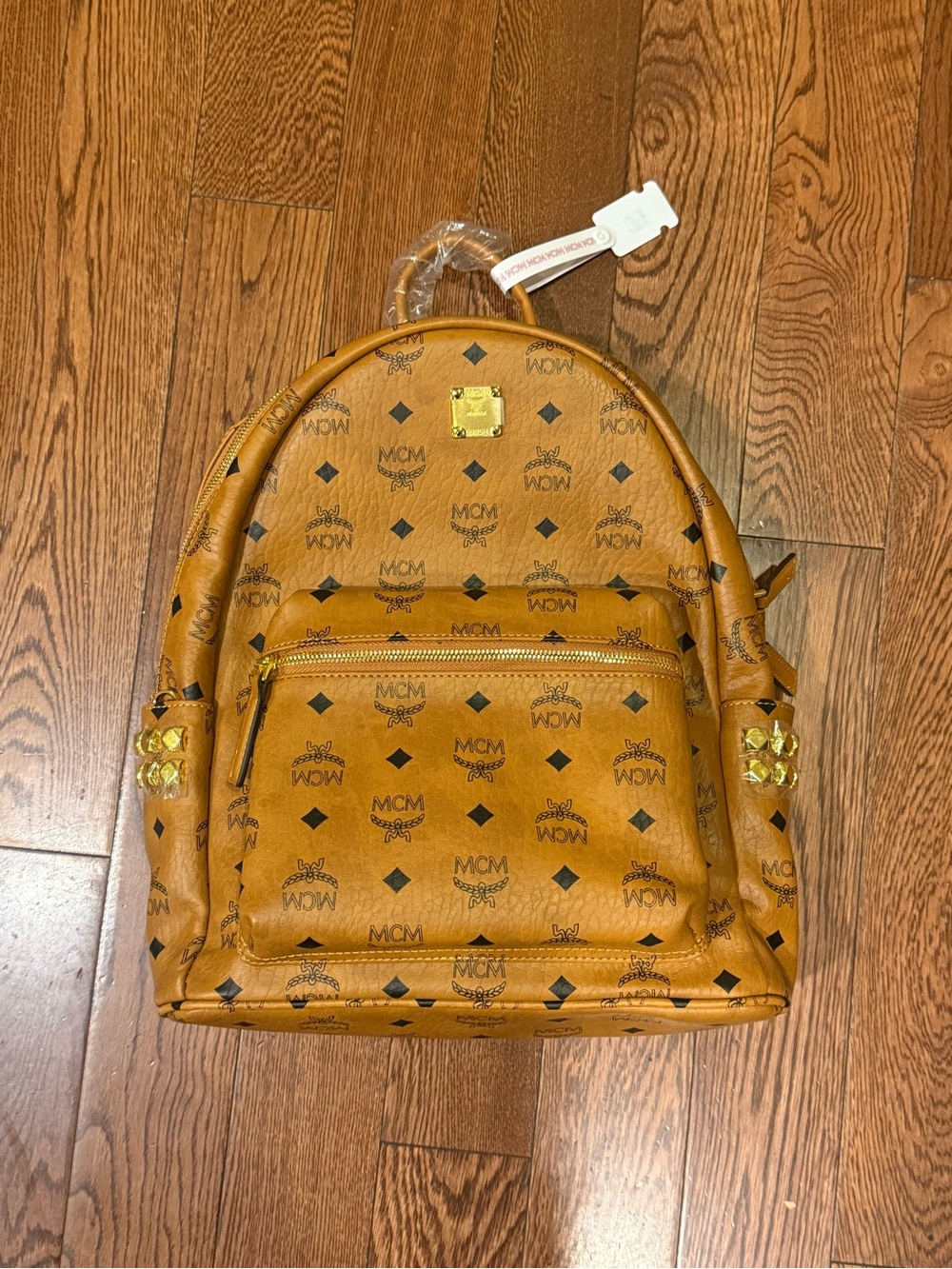 MCM Backpack size medium with Gold studs. DM before buying